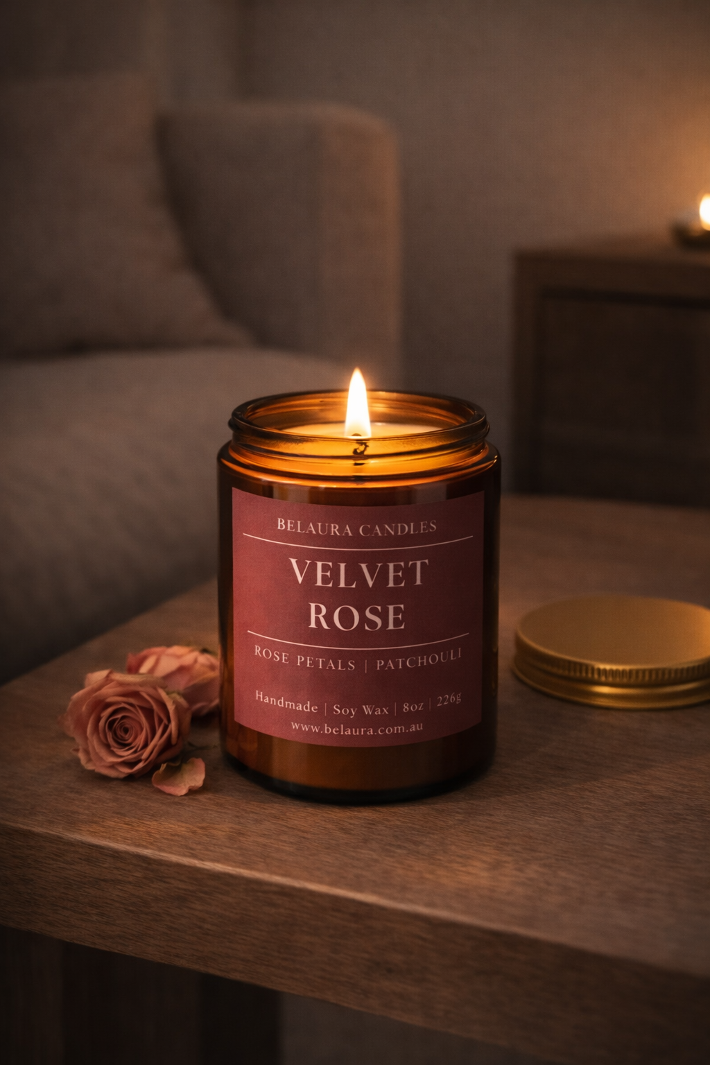 Close-up of Velvet Rose candle label on amber jar